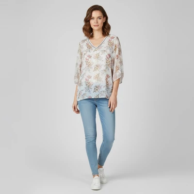 Virágmintás, nyakrészén gyöngyökkel díszített női felső