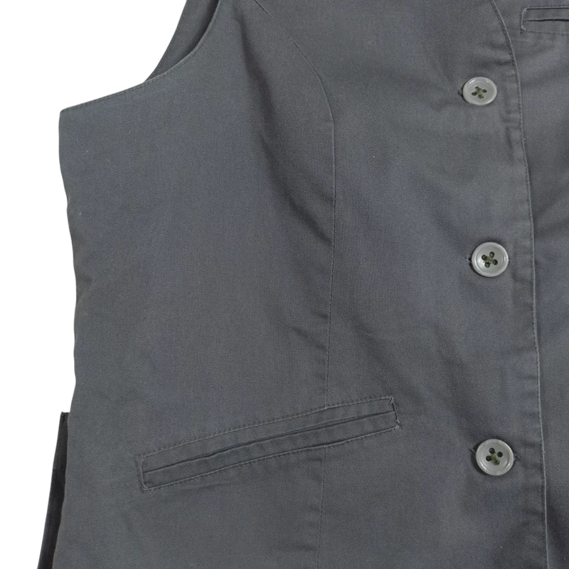 Elején gombos és zsebes női felső (mellény)