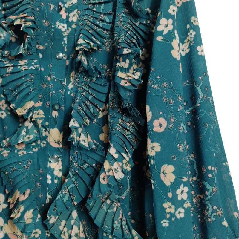 Elején gombos és fodros, alján megkötős, mintás női felső 