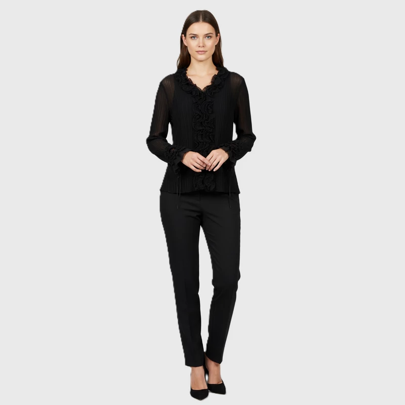 Áttetsző anyagú, elején gombos, sok fodorral díszített női felső 