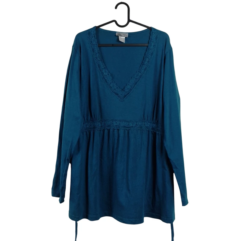 Csipkével díszített, derekán hátul megkötős női felső